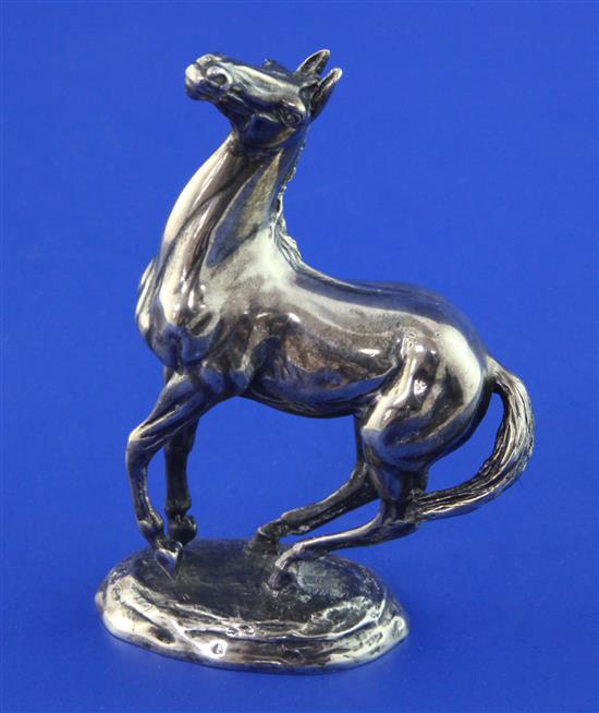 A cased 1970s silver model of a horse, Playing Up after Lorna McKean, for The British Horse Society, 19.5 oz.